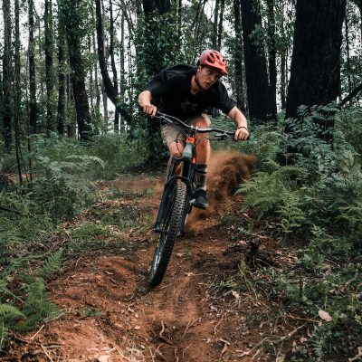 Photo by Oskar Smethurst man riding bicycle on forest during daytime